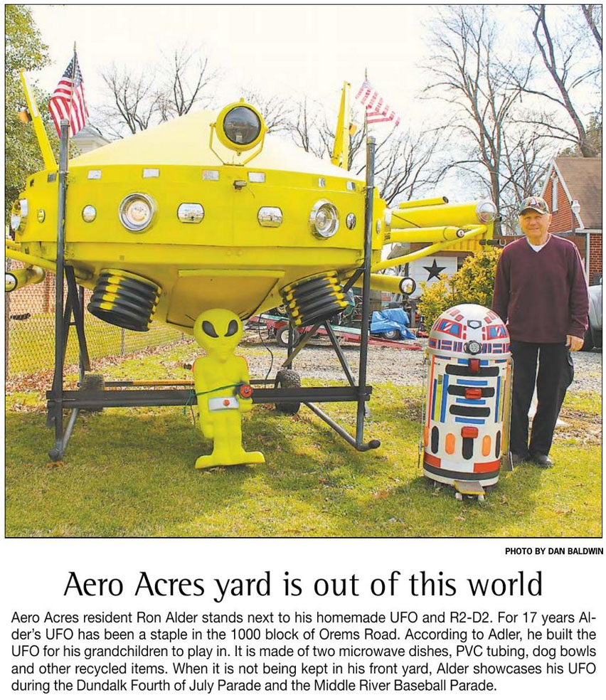 Aero Acres resident Ron Alder stands next to his homemade UFO, 2016
