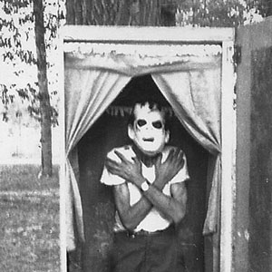 Ben Taylor Standing in Coffin with Frankenstein Mask On, 1970